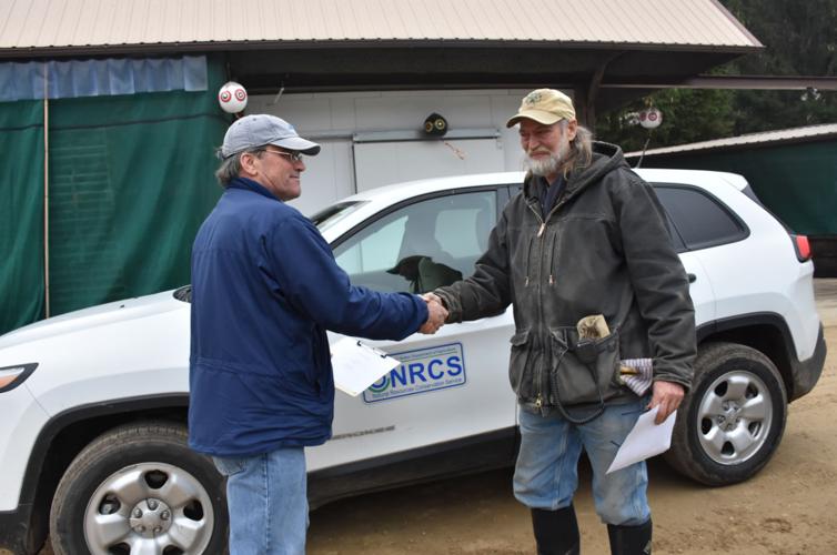 Sam Skemp and Richard de Wilde shake hands