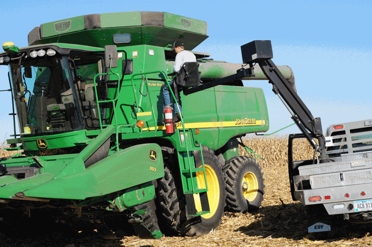 farmer lift into combine