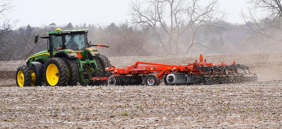 Spring fieldwork tractor in field