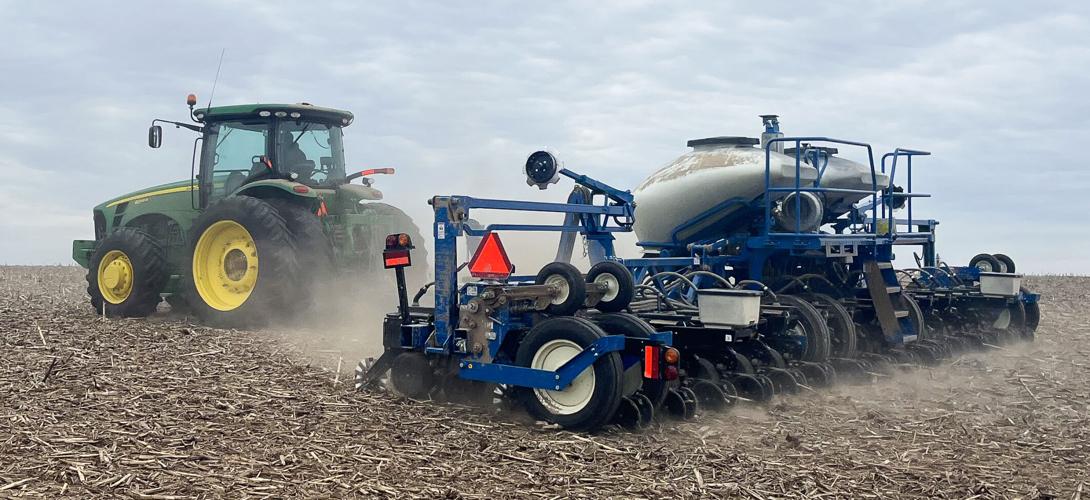 Tractor planting soybeans