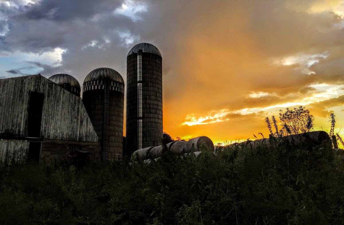 Sunset sunrise on the farm with silos