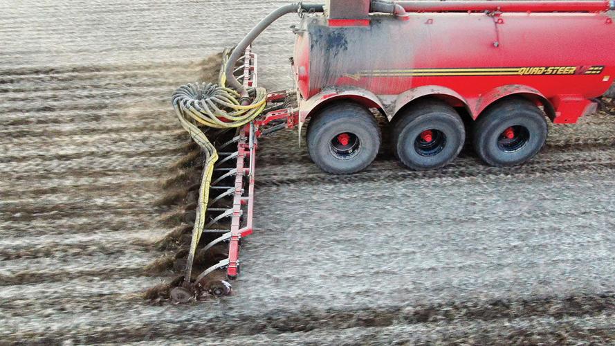 Manure spreader in field