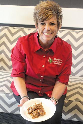 Tonya Walker displays a piece of apple crisp.