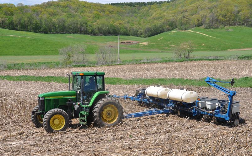 Tractor and planter in field