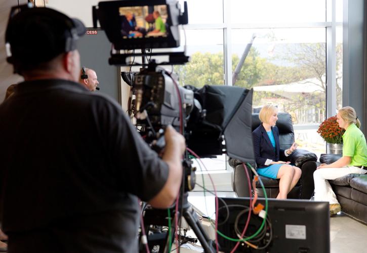 Kristin Olson conducting interview at World Dairy Expo