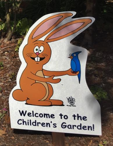 rabbit in children's garden says welcome