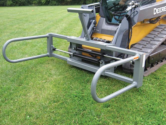 Dual arm bale squeeze