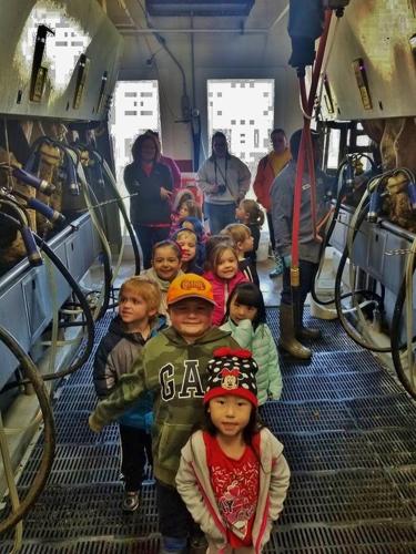 Kids stand in parlor