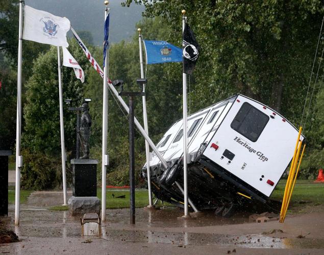 Bus tipped by floodwaters