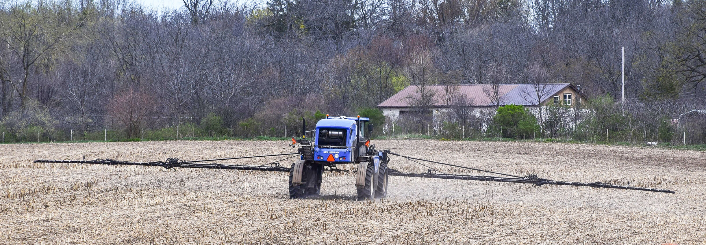Spring fieldwork sprayer in field