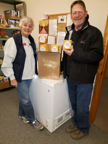 Larry Hermanson delivers cheese donation to Argyle Food Bank