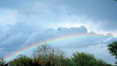 weather with clouds and rainbow