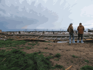 2-guys-by-broken-pig-shed.gif