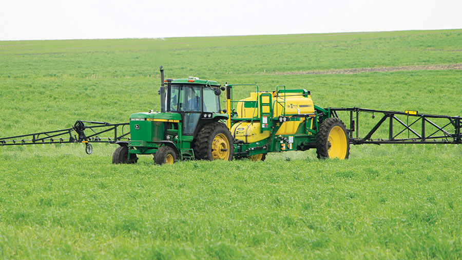 Mark Mueller sprays cover crop