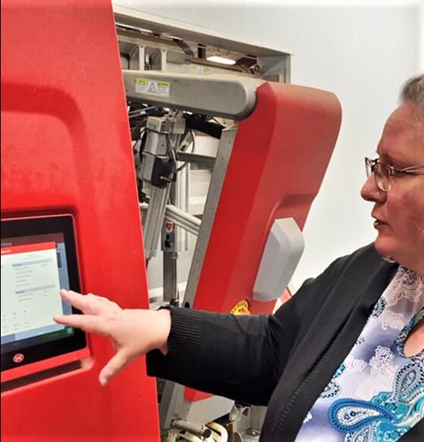 Tera Montgomery with robotic milking system