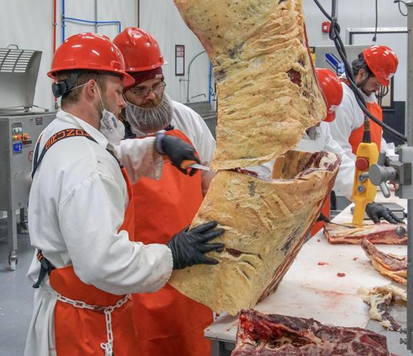 Workers process beef