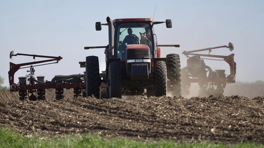 Tractor planter in field