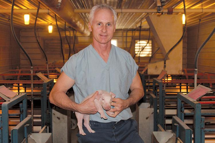 Pat Bane with piglet