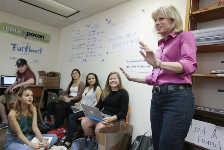 Mary Burke talks to student volunteers