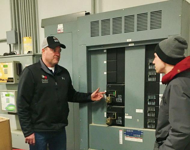 Chuck Imig and Mack Drees at electrical panel