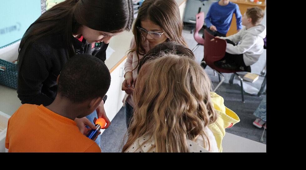 Kids with hatching chicks