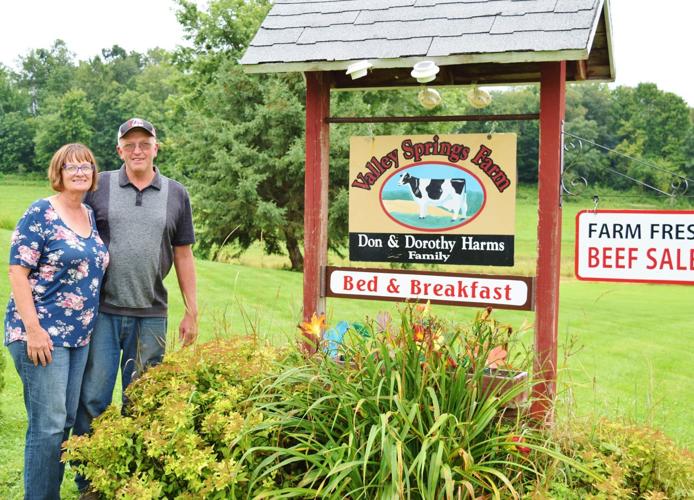 Dorothy and Don Harms with Valley Springs Farm Bed and Breakfast and beef sales signs