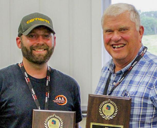 Josh Scharf and Jerry Huth with awards
