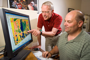 ARS agricultural engineers Roger Eigenberg (left) and Bryan Woodbury