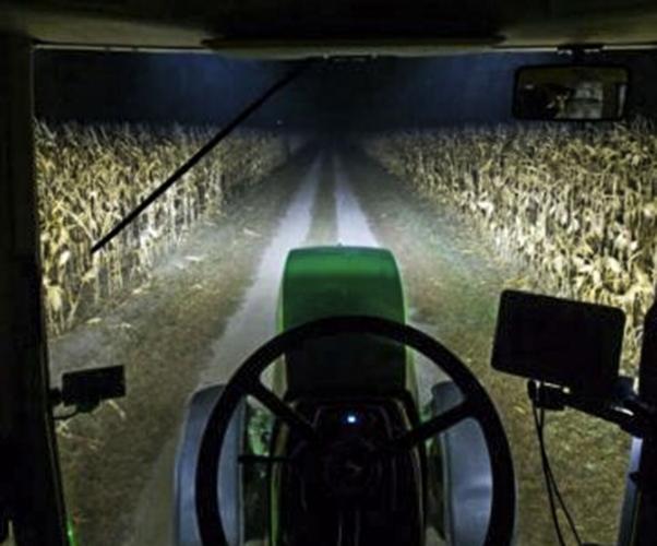 Tractor in field at night