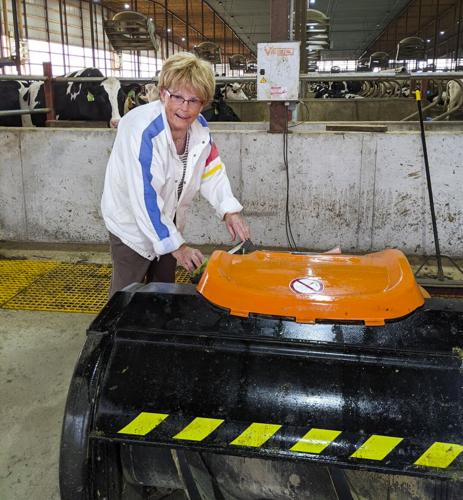 Elaine Solum washing a feed pusher