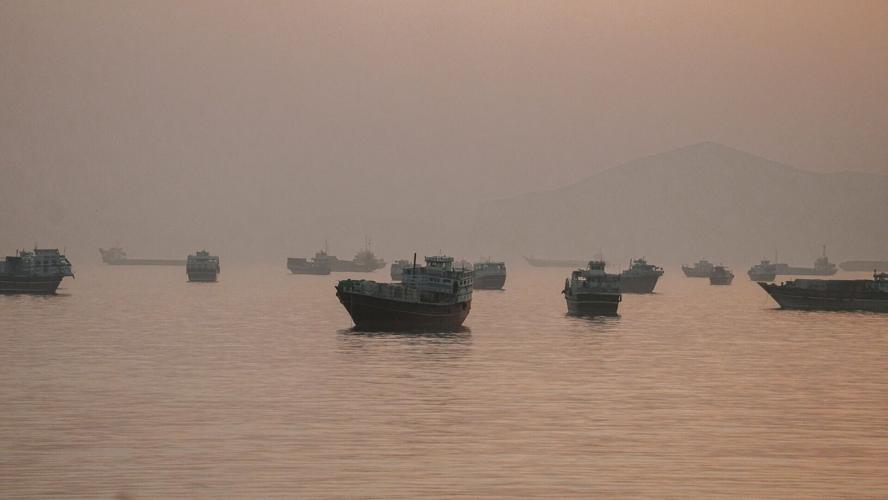 FILE PHOTO: Vessels are anchored in the Strait of Hormuz as seen from Musandam