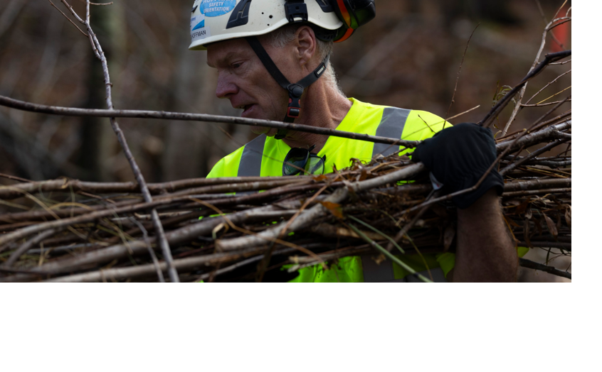 Jim Hoffman carrying sticks