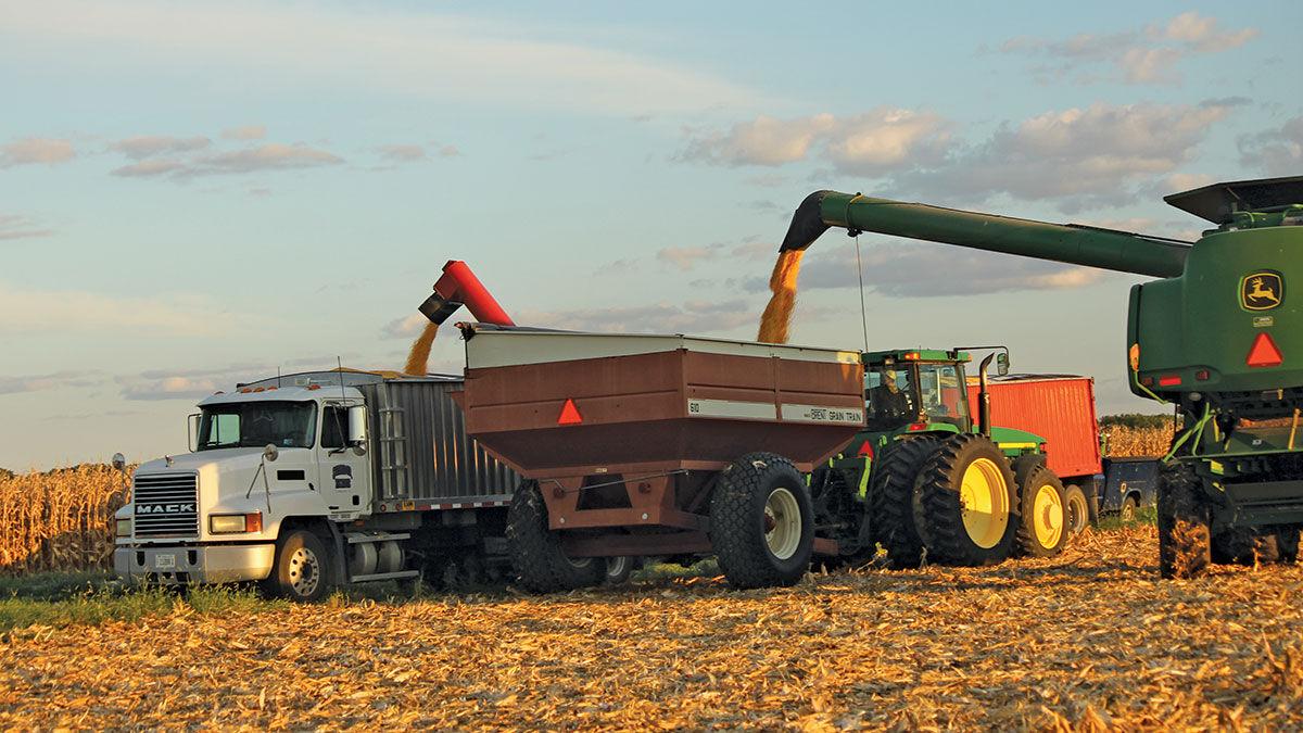 Chris and Ron Schoor unload the wagon
