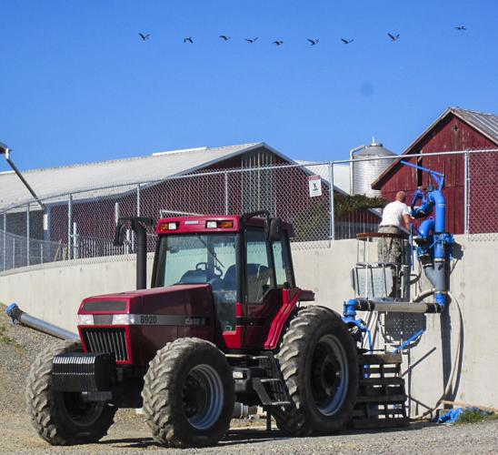Man with manure agitator equipment