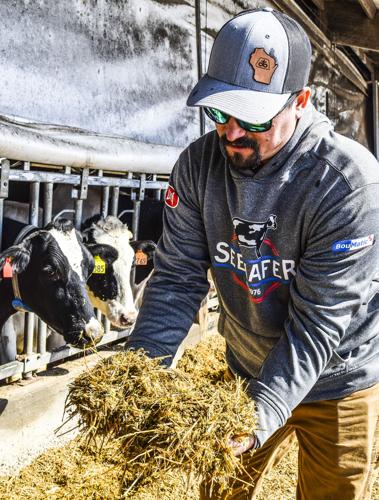 Travis Marti with silage sample