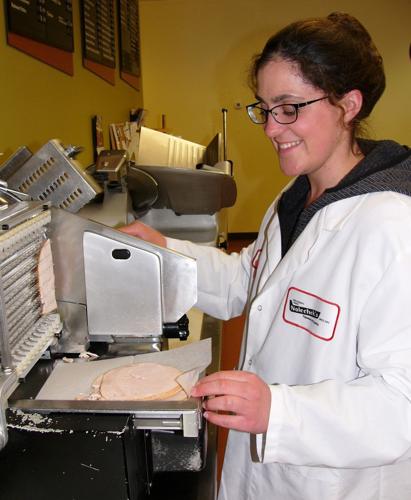 Caroline Zeiset slices luncheon meat