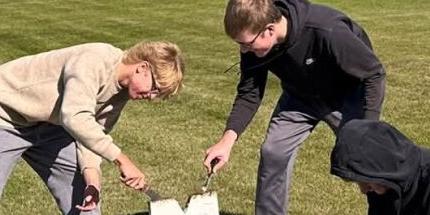 Napoleon FFA Chapter painting at the baseball field