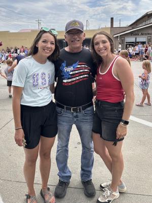 Schneider with his two daughters