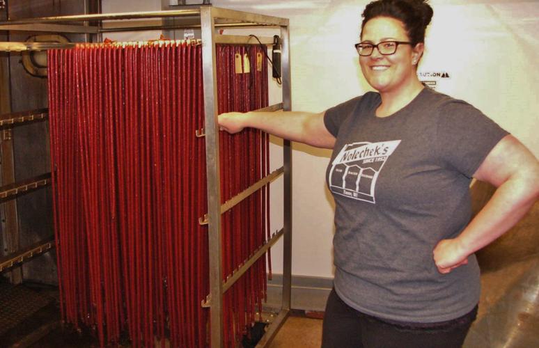 Lindsey Fox checks snack sticks