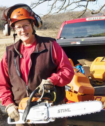 Marci Hess with chain saw