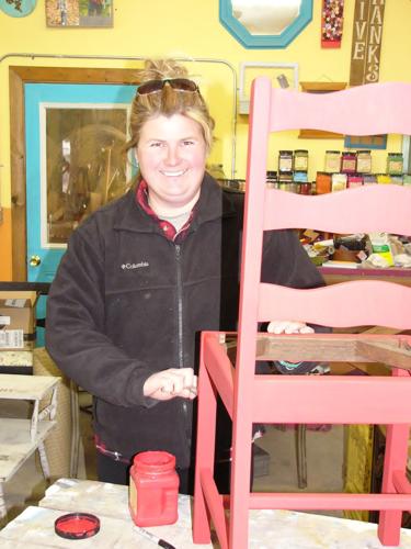 Lynn Hicks paints chair