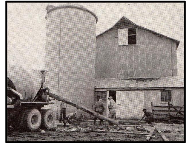 Workers pave a barnyard on the Ward farm for the 1956 Wisconsin Farm Progress Days show in Jefferson County.