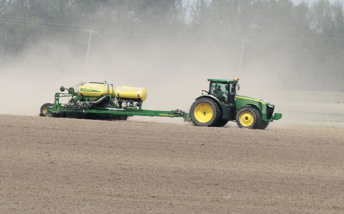 Greg Schorfheide plants corn in a field