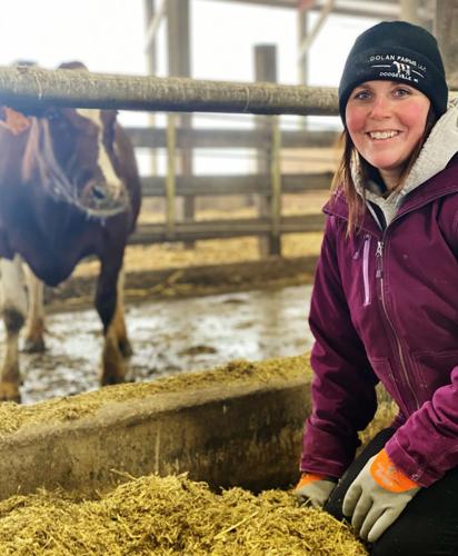 Krista Dolan in freestall barn