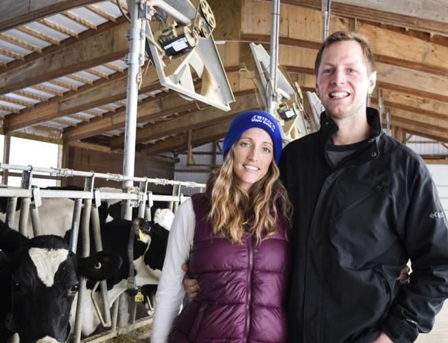 Rachel and Kyle Zwieg in freestall barn