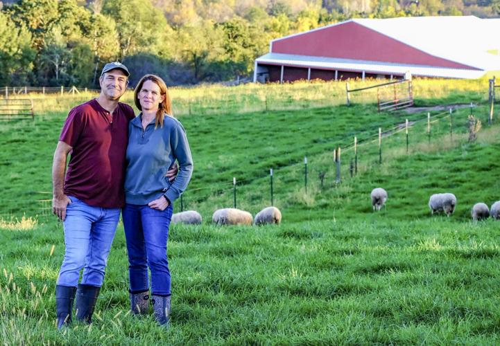 Travis and Amy Forgues with sheep