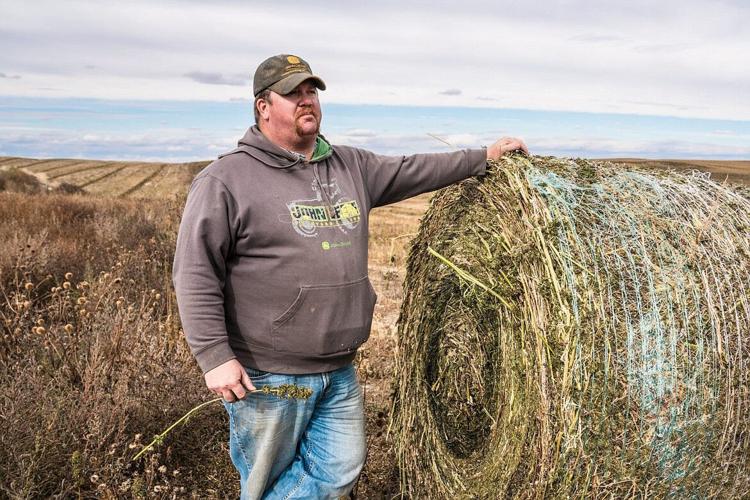 Beau Anderson with his hemp bales