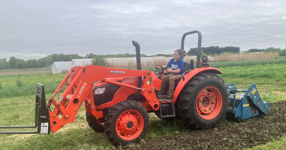 Lia Basden on tractor