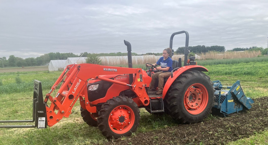 Lia Basden on tractor