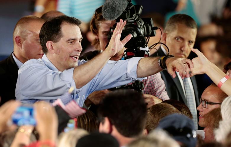 Scott Walker greets crowd Monday